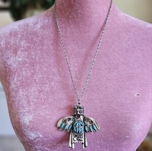 Vintage 70's Kachina pendant. Silver tone metal and faux turquoise.